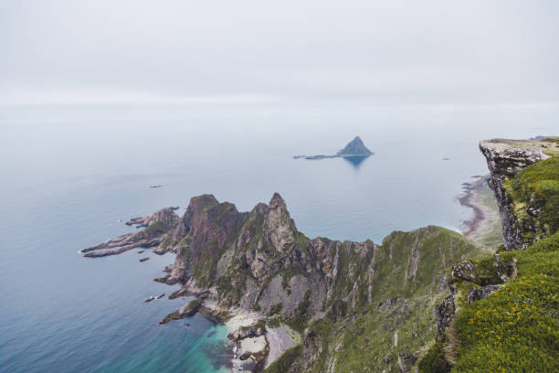 istock Scenic view of mountain range in sea. 1061036806