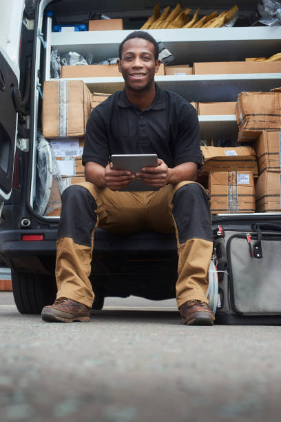 istock Tradesman doing invoices digital tablet 1061038086