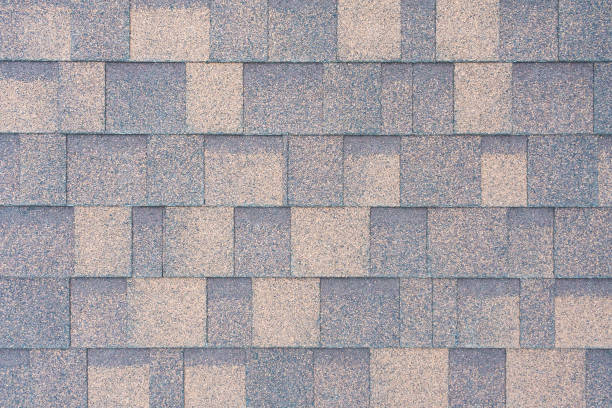 istock Top view on a flexible tiles on the roof as texture, background 1061039520