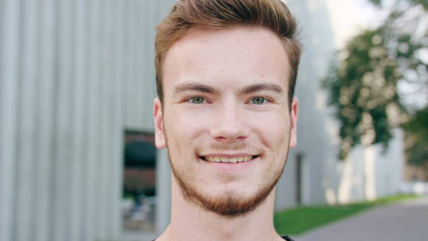istock Red-Haired Men with Beard Smiling in Town 1061039798
