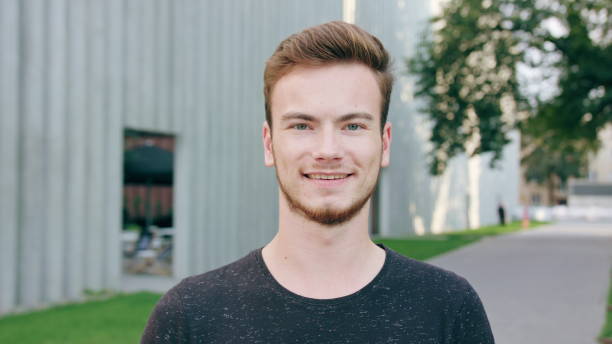 istock Red-Haired Men with Beard Smiling in Town 1061039816