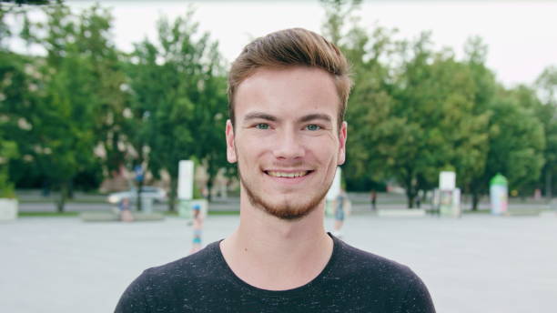 istock Red-Haired Men with Beard Smiling in Town 1061039850