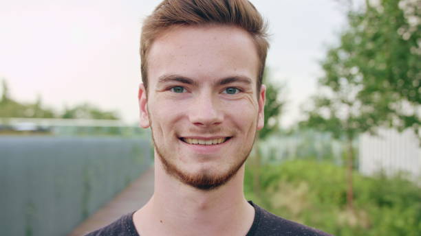 istock Red-Haired Men with Beard Smiling in Town 1061039994