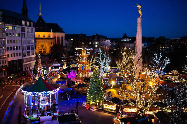 istock Christmas market. Winter fair with tree and lights. 1061040208
