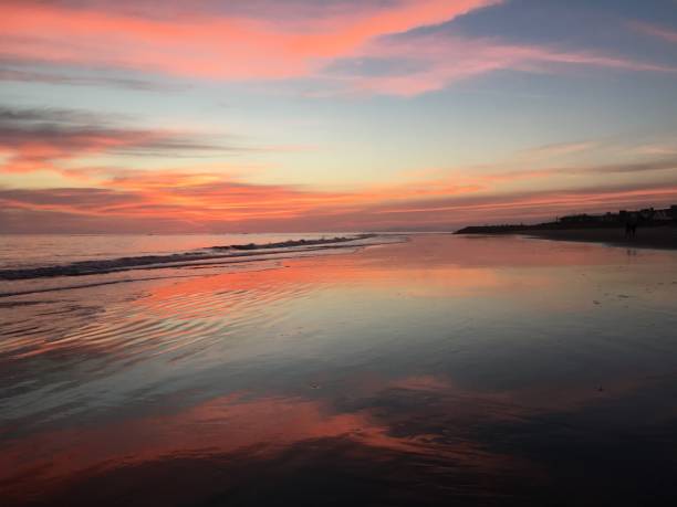 istock Dramatic pink sunset and the rock wall 1061042154
