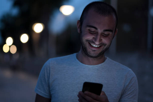 istock A young man texting and call on the phone 1061042276