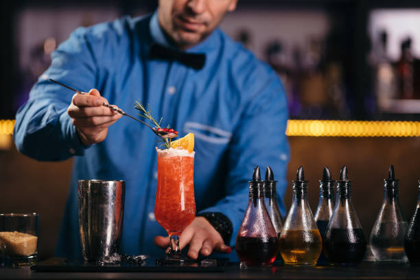 istock Bartender preparing cocktail in nightclub 1061043086