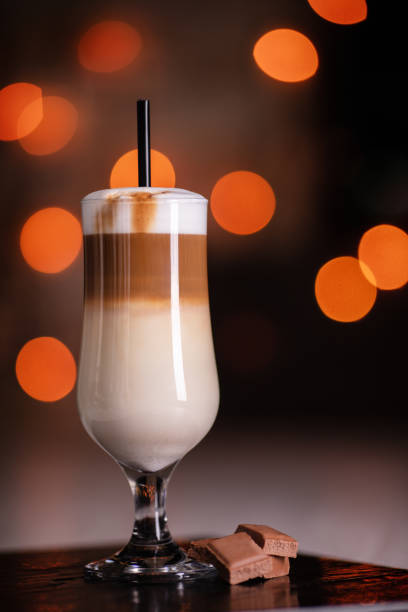 coffee with milk in glass cup on metal table