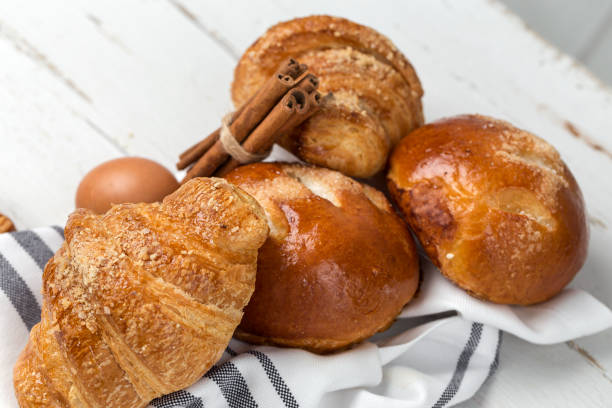 istock freshly baked buns with almonds. Croissants and brioches 1061049900
