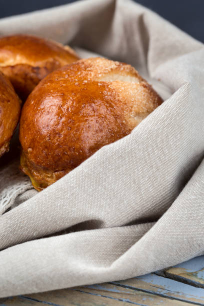 istock freshly baked buns with almonds. Croissants and brioches 1061049914