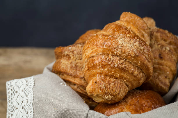 istock freshly baked buns with almonds. Croissants and brioches 1061049940