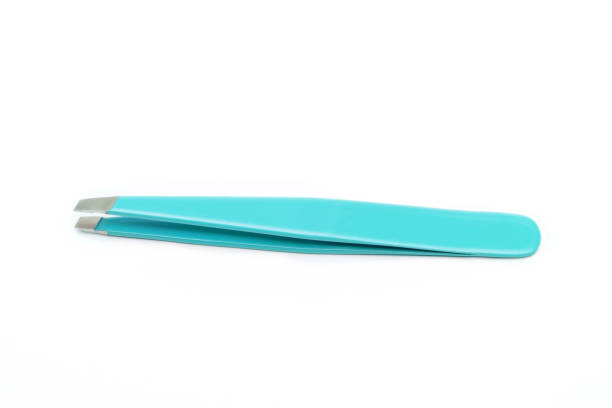 Blue-green clean tweezers on white background