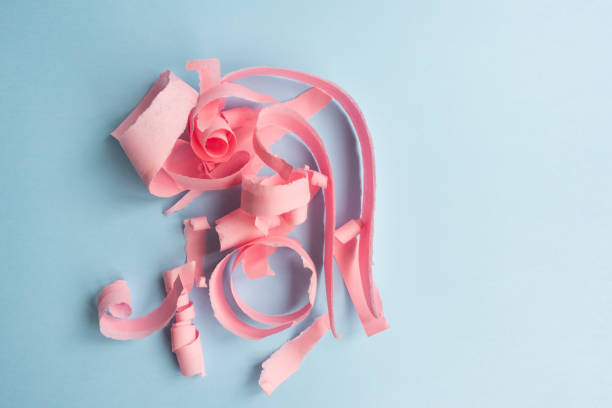 istock Abstract background - torn pink paper on blue 1061057354