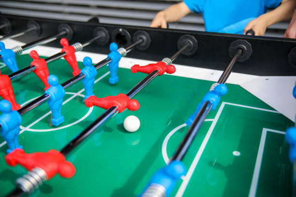 istock Children playing foosball 1061058654