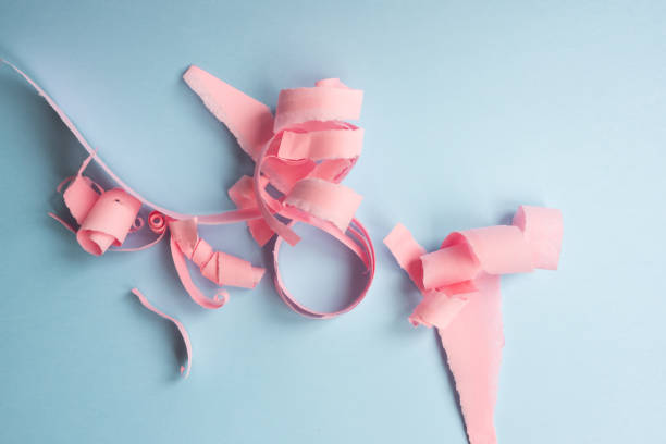 istock Abstract background - torn pink paper on blue 1061059170