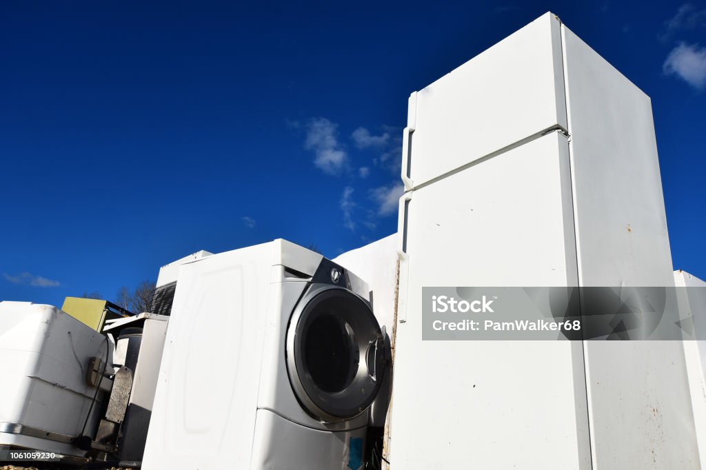 Appliance Recycling An image of several old appliances at a recycling facility. Appliance Stock Photo