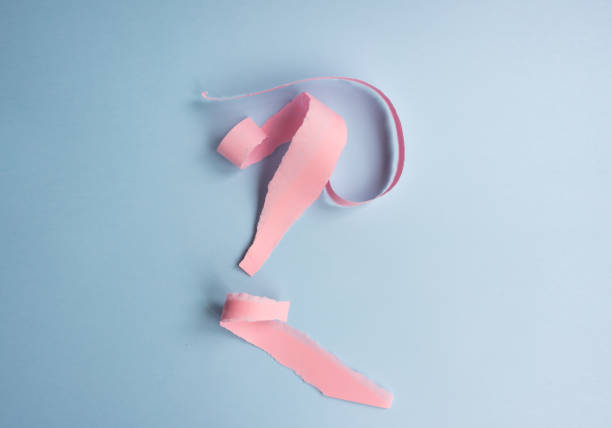 istock Abstract background - torn pink paper on blue 1061060614