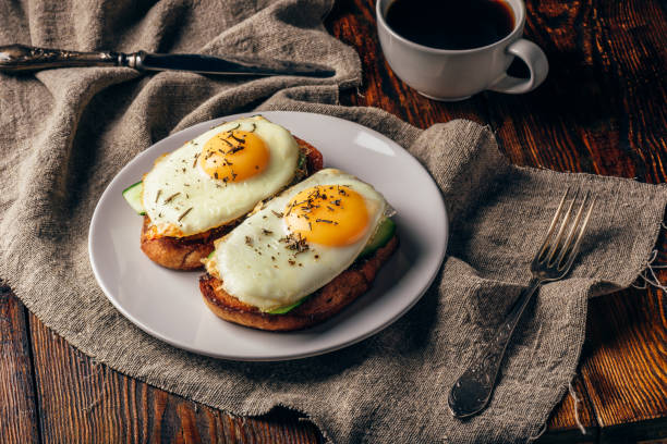 istock Toasts with vegetables and fried eggs with cup of coffee 1061060640