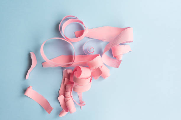 istock Abstract background - torn pink paper on blue 1061060918