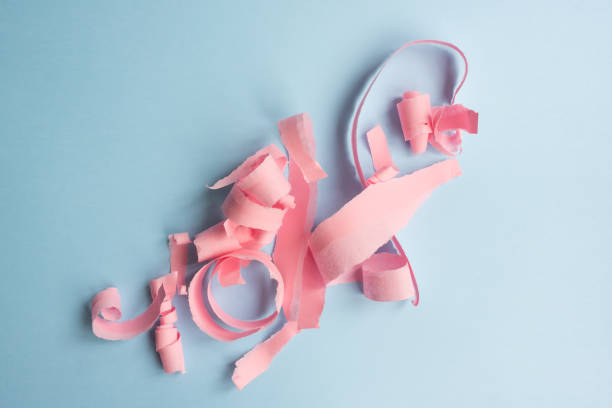 istock Abstract background - torn pink paper on blue 1061062422