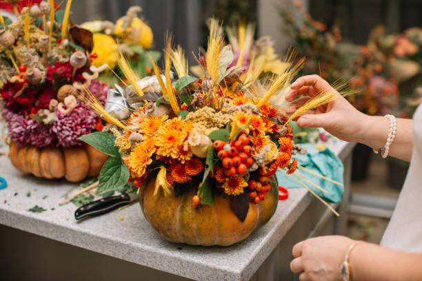 istock Women preparing Halloween pumpkin head. 1061062980