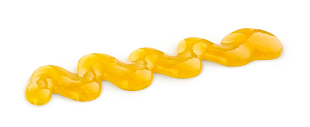 istock banana syrup drizzle isolated on white background 1061069488