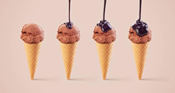 istock ice cream in waffle cup with poured chocolate set 1061069880