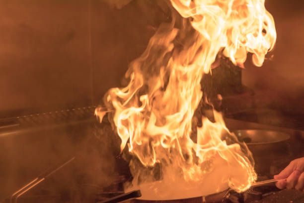 istock Crop hand holding burning frying pan 1061073656