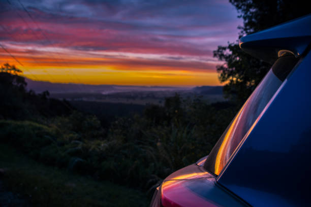istock Shiny car against sunset sky 1061073778