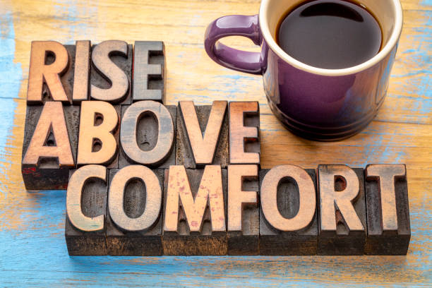 istock rise above comfort - word abstract in wood type 1061077724