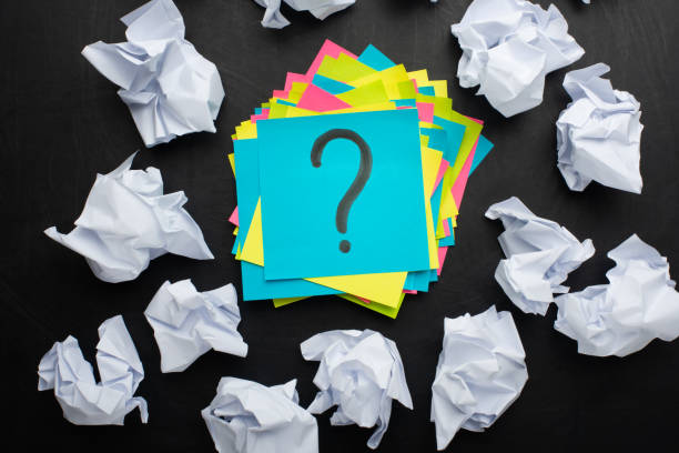 istock sticker with a question mark and around crumpled paper, concept ideas, torment to ideas 1061081056