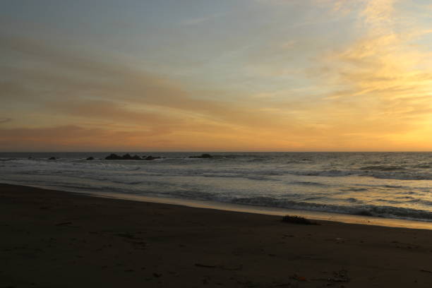 istock Walking on the beach at sunset 1061082722
