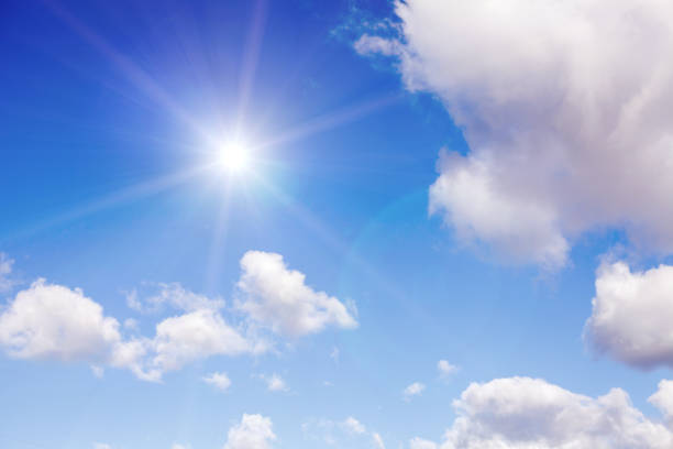istock clouds against a blue sky with rays of the sun 1061084808