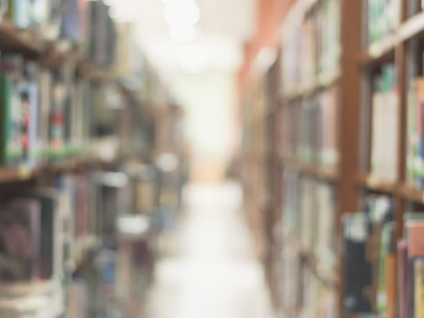 istock Blur school library or study room with book shelves for education background 1061084856