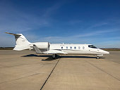 Bombardier Learjet 60 business jet parked at regional airport