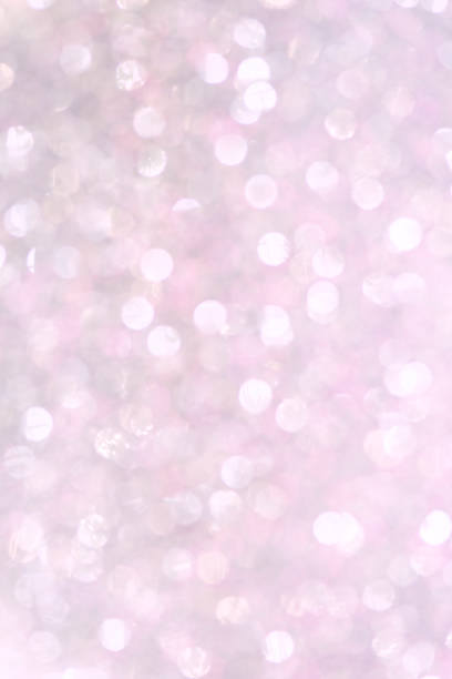istock Sillver bokeh texture. Festive glitter background with defocused lights 1061114404