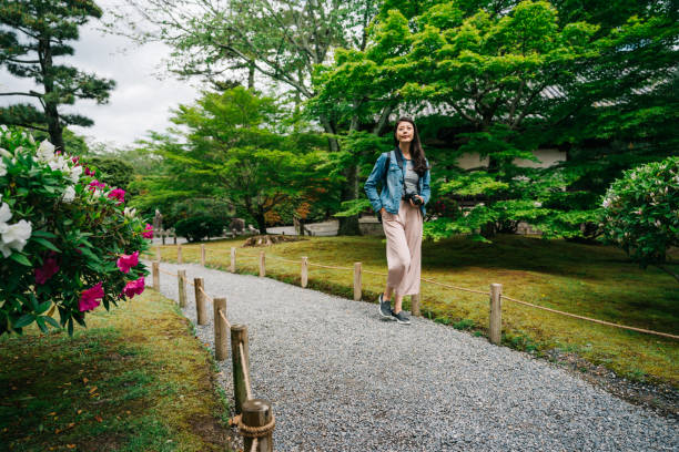 elegant female traveler walking  on the path