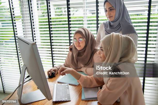 Group Of Muslim Students Using And Learning With Computer Stock Photo - Download Image Now