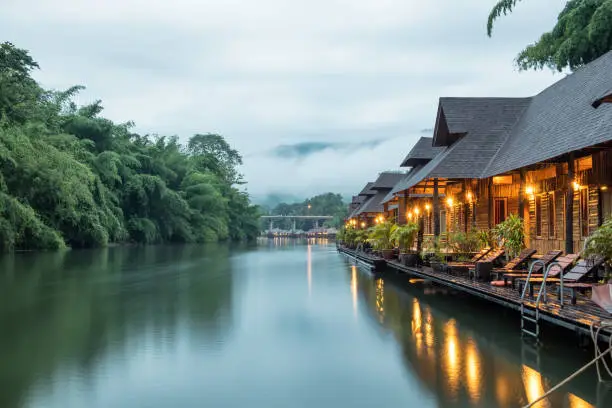 Resort wooden house floating and mountain fog on river kwai at sai yok,kanchanaburi,thailand