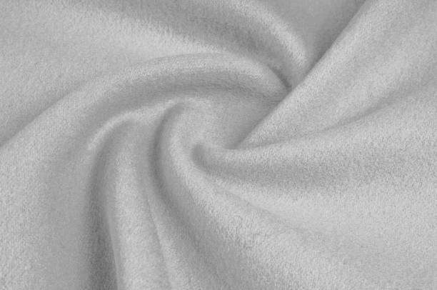 istock Texture, background, pattern. Woolen fabric for outdoor clothing, white gray 1061149468