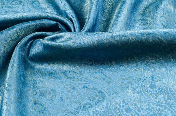 istock Background texture, pattern. Blue paisley silk chiffon mod fabric by the yard. Crinkled, flowy, soft, very light, 1061149492