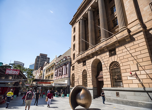 View of the commercial Queen Street Mall with the heritage listed Bank of New South Wales building on the right, in Brisbane, Australia