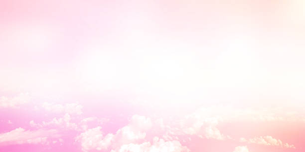 istock abstract blurred pastel pink color tone as panoramic background and clouds with glowing shine light filter for design concept 1061151680
