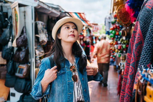 istock traveler looking at the colorful textile cloth 1061153100