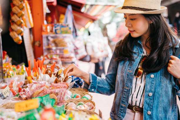 istock lady choosing sweets at the candy vendor 1061153118