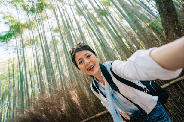 istock tourist taking selfie in the bamboo grove 1061154104