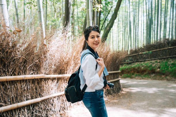 istock beautiful tourist turning back 1061154140