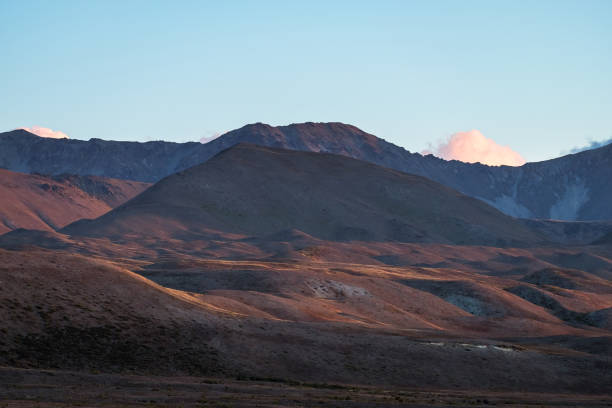 istock Beautiful colorful grassland mountain with blue sky at sunset. 1061159444