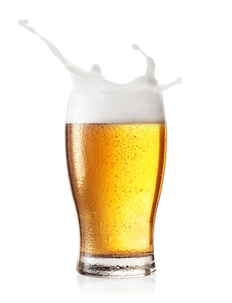 Splash in a glass of beer stock photo