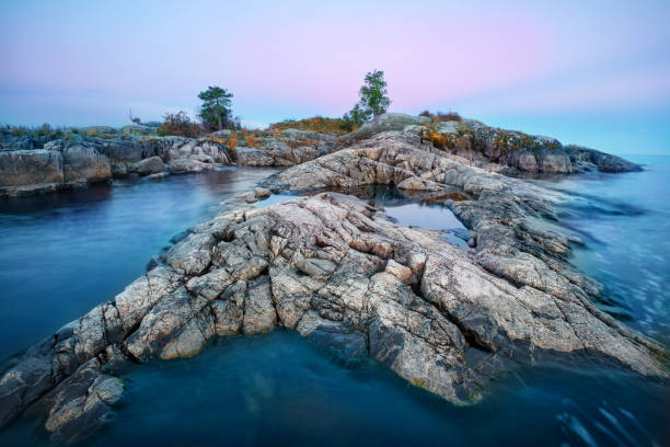 Mysterious stone island in sea Mysterious stone island in the sea republic of karelia russia stock pictures, royalty-free photos & images